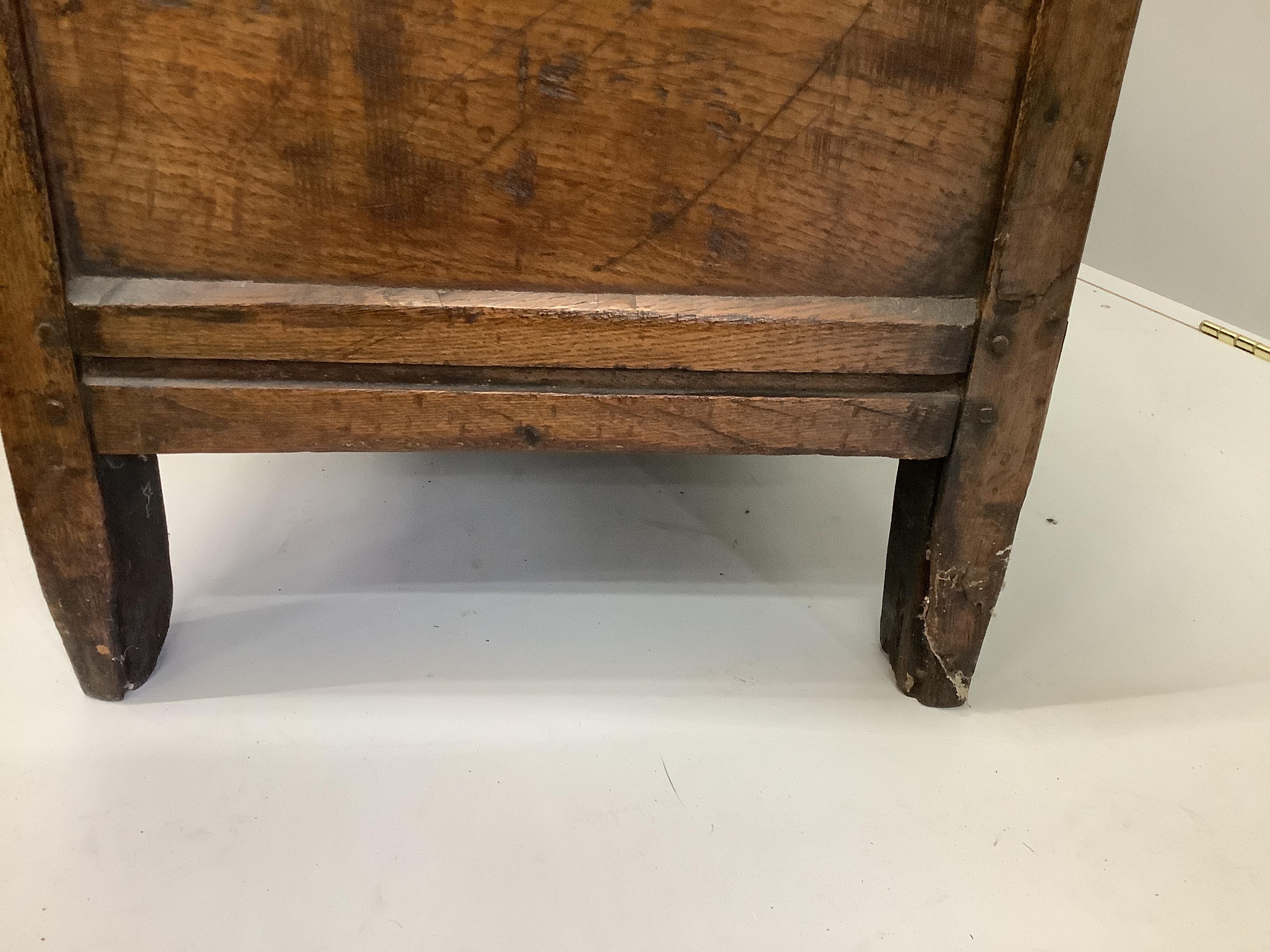 An early 18th century panelled oak coffer, length 121cm, depth 49cm, height 58cm
